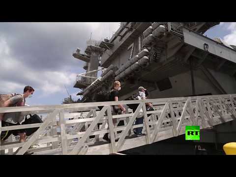 شاهد العسكريون يعودون إلى حاملة تيودور روزفلت الأميركية