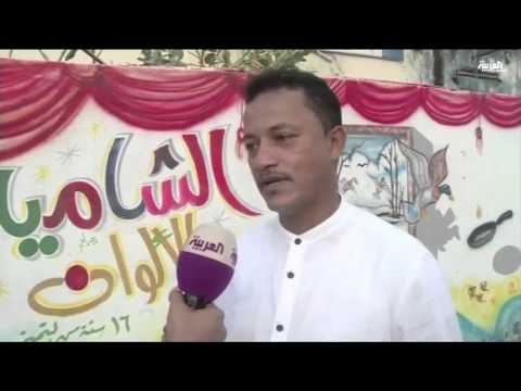 شاهد حارة الشامية في جازان تتزين بلوحات فنية