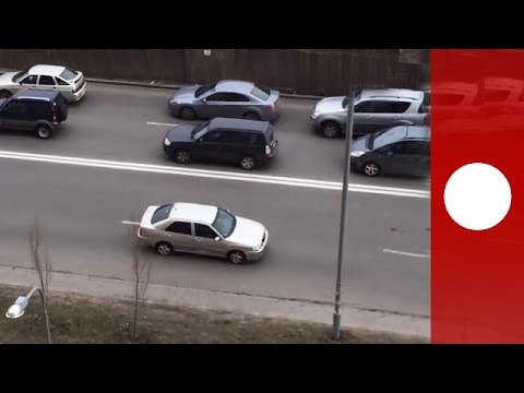 ukrainian drivers unusual way of avoiding traffic jamin reverse
