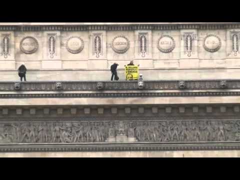 a group of greenpeace activists scaled paris
