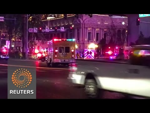 after a car drove into pedestrians on a crowded sidewalk