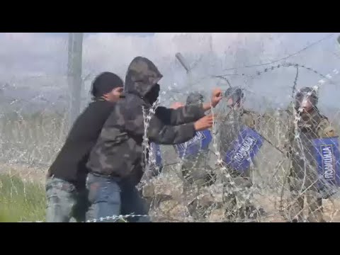 refugees attempt to dismantle fence at greek idomeni camp get teargassed