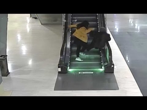 saves elderly woman on escalator