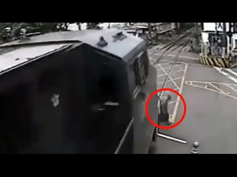 old man narrowly avoids being hit by train in brazil