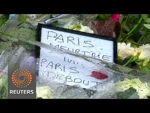 mourners pay tribute to the 129 people who lost their lives