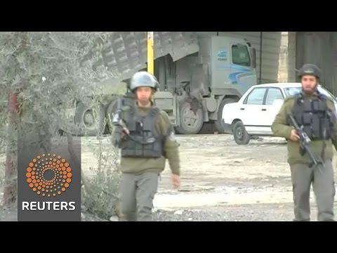 palestinian shot dead after car attack on troops